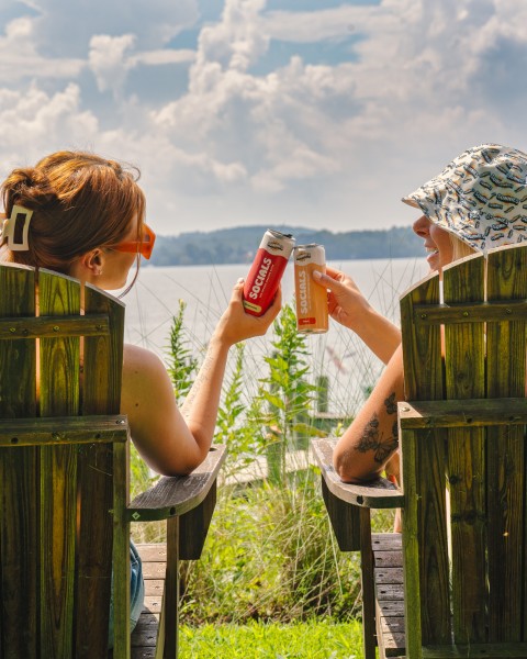 two people drinking THC beverages