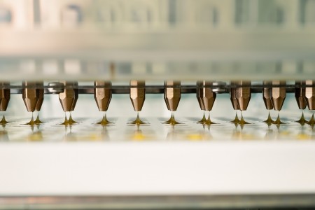 oil being dispensed into molds